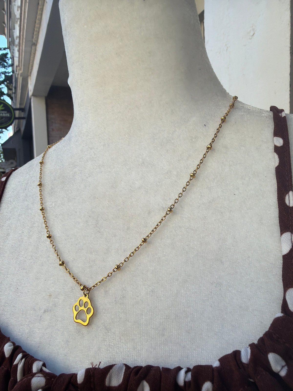 Gold satellite Paw print necklace 