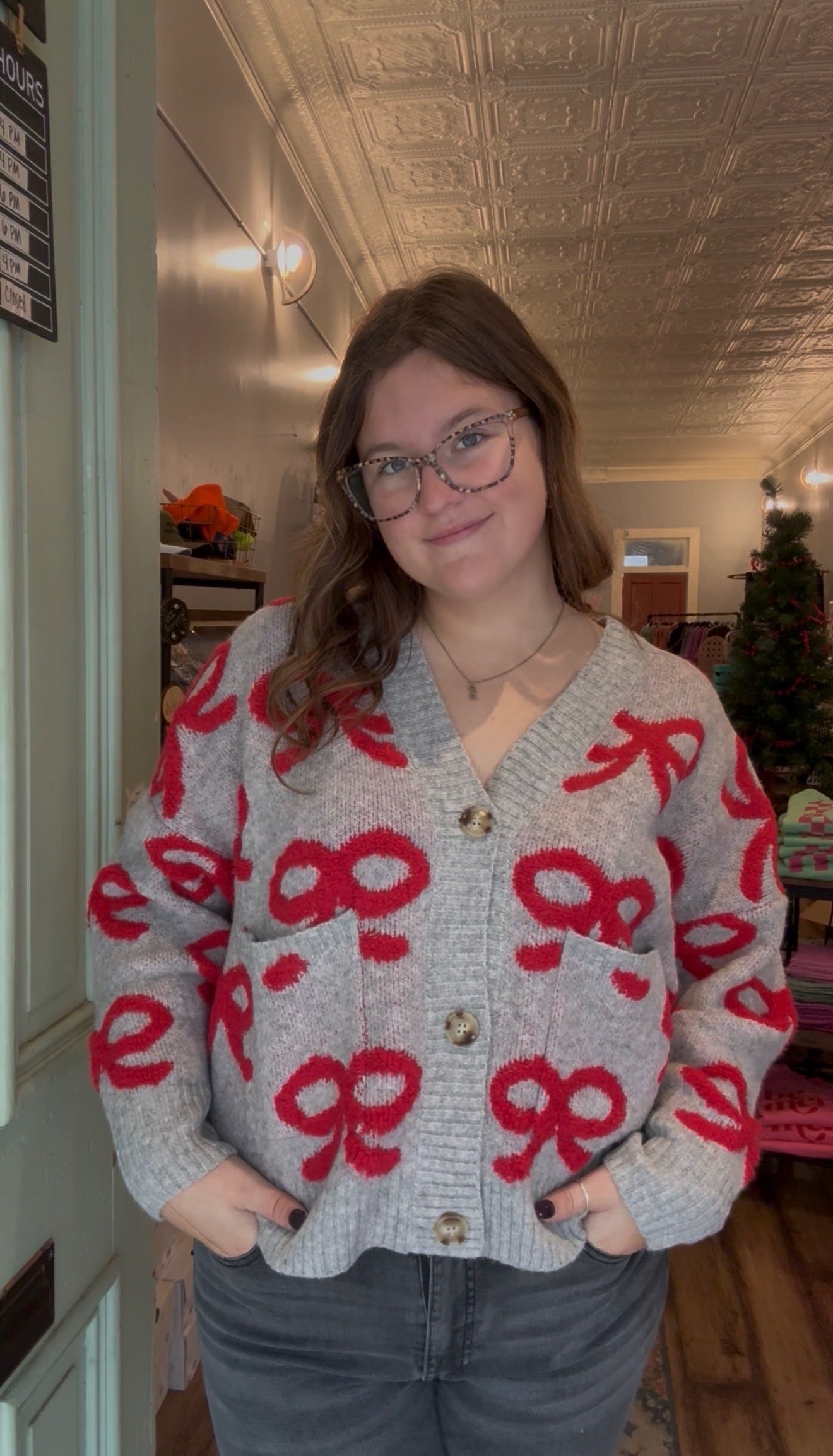 BOW PATTERN BUTTON DOWN KNIT CARDIGAN