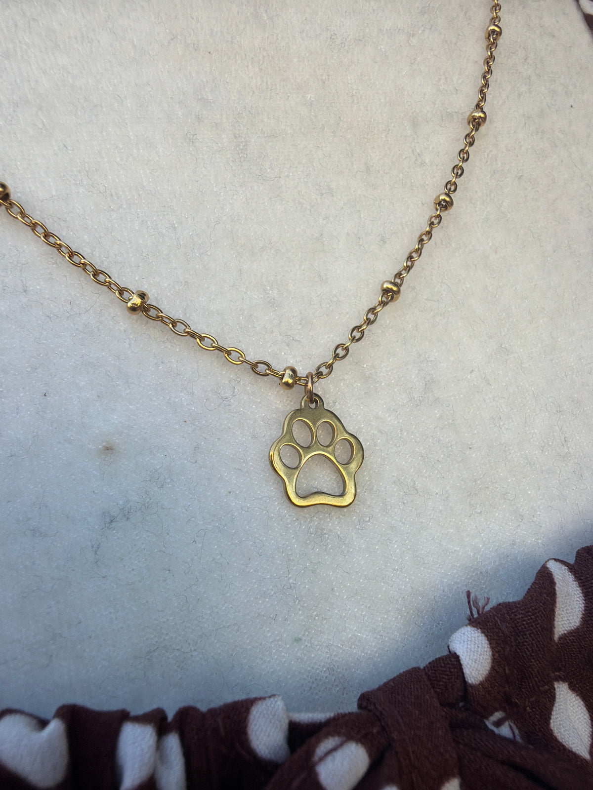 Gold satellite Paw print necklace ￼